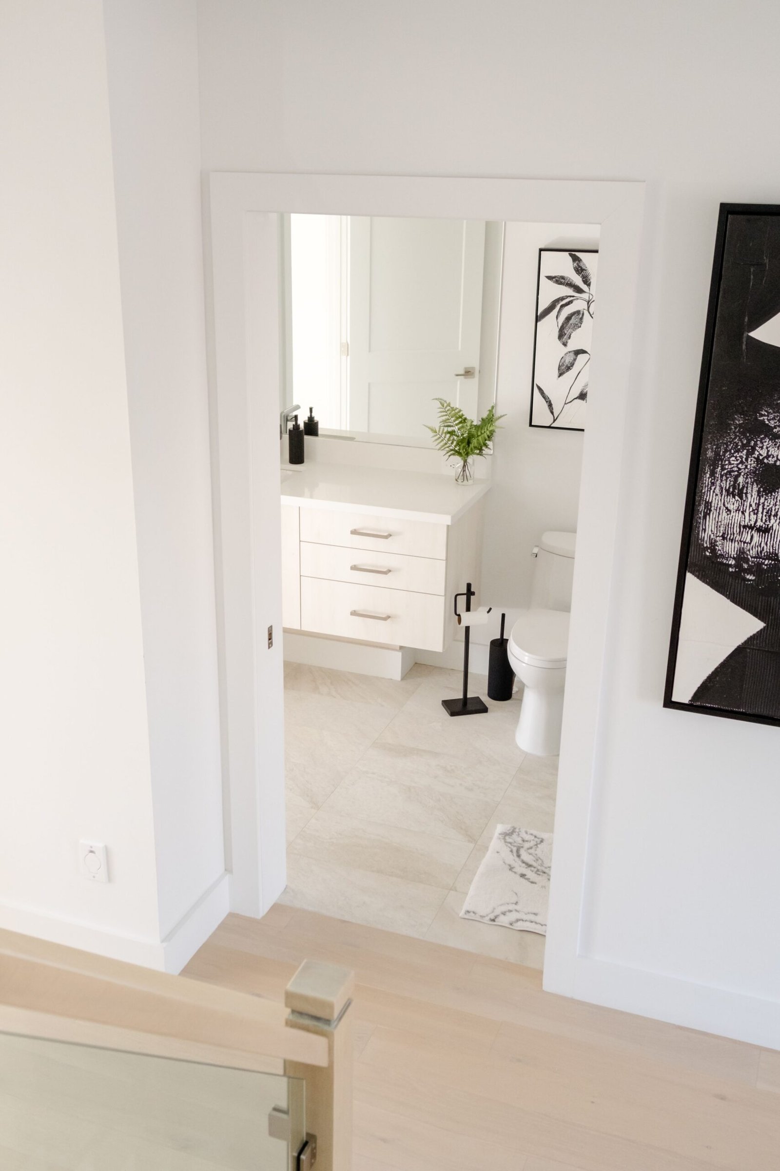 Bright and clean minimalist bathroom with modern decor and neutral tones.
